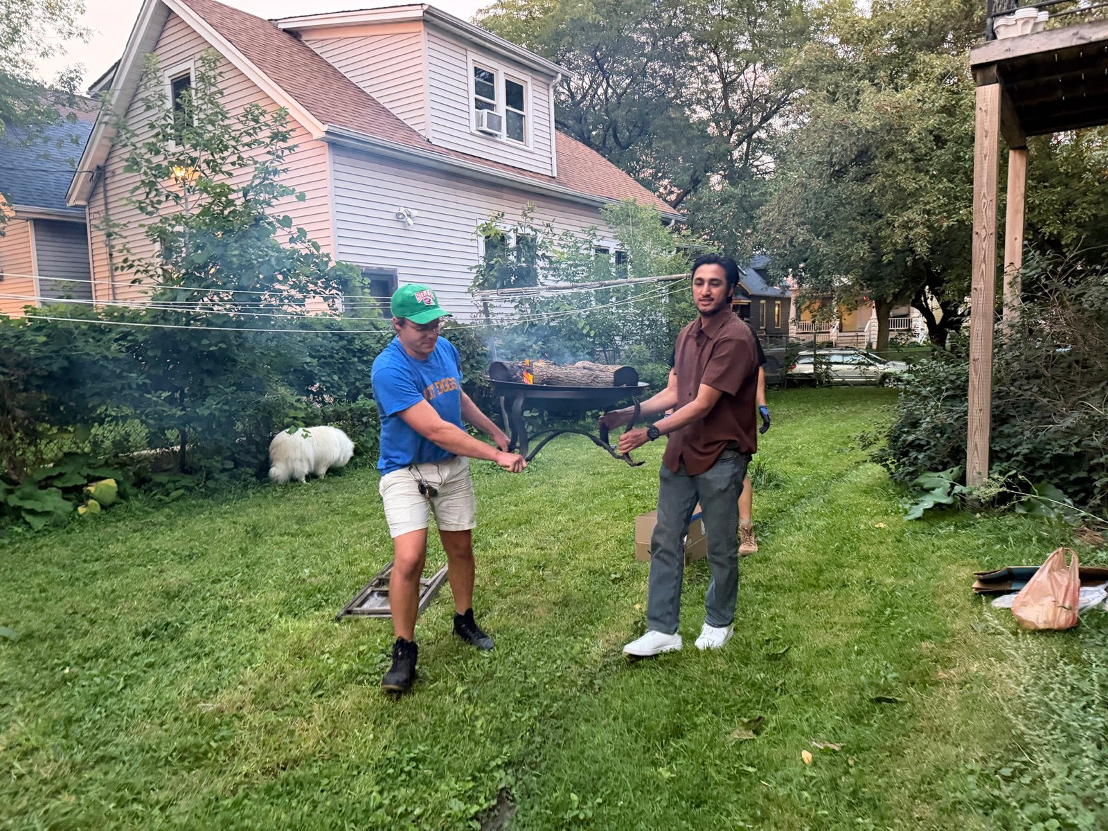 Nic and accomplice carrying fire pit