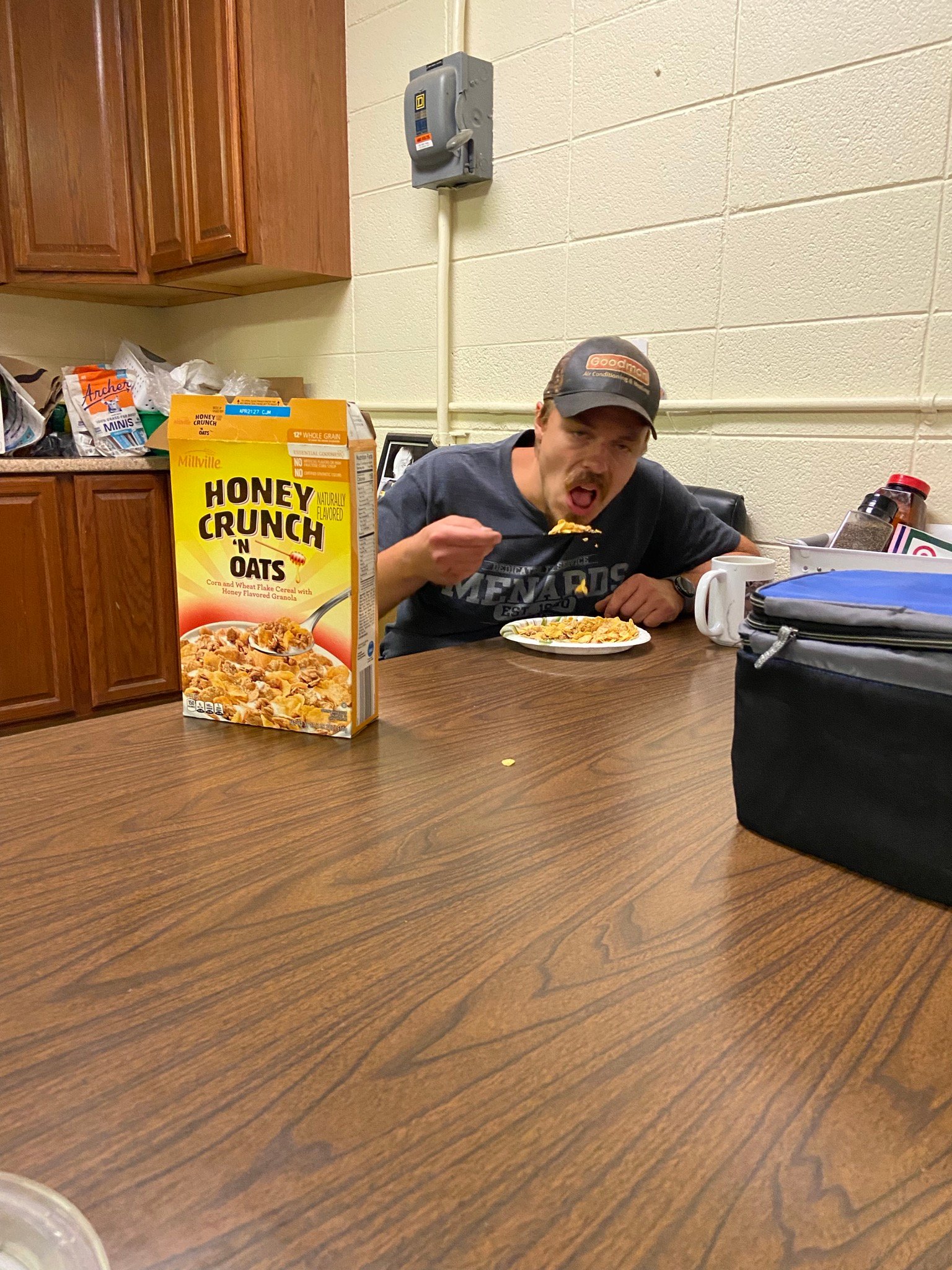 Nic eating cereal off of a knife